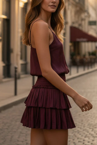 Mystra Silk Crop Top in wine, side view worn with a pleated tiered mini skirt