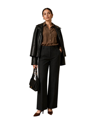 Scarlett High Collar Leather Jacket in black, full front view draped over shoulders with brown shirt and trousers