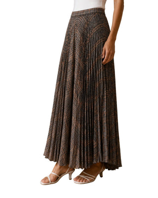 Melania Plaid Midi Skirt, side view showing pleats flaring from the waist, with strappy white heels