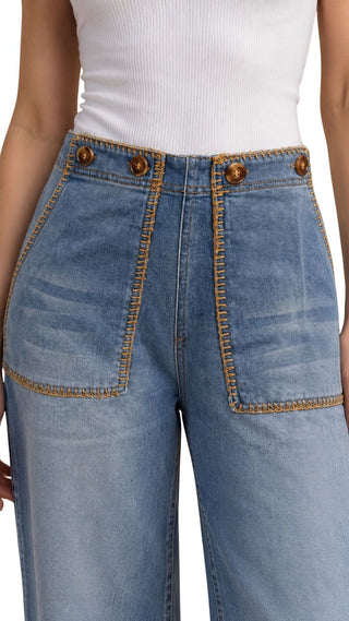Ophie Straight Leg Cropped Jeans in light wash, close-up of the tan topstitched pockets and tortoise buttons