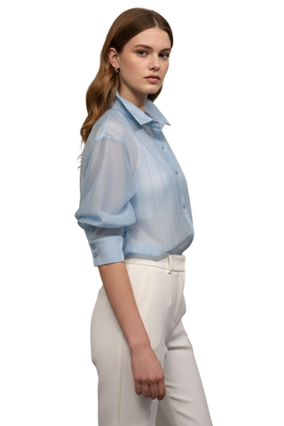Radiance Button Down Shirt in blue, side view showing the three-quarter puff sleeve and buttoned cuff