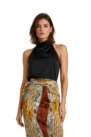Ellen Satin Halter Top in black, front view with draped high neck, worn with a printed wrap skirt