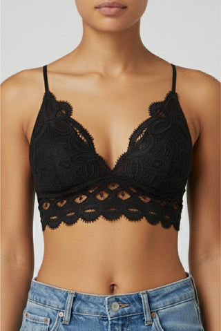 Our Lace Bralette in black, close front view of the plunging V neckline and open lace hem