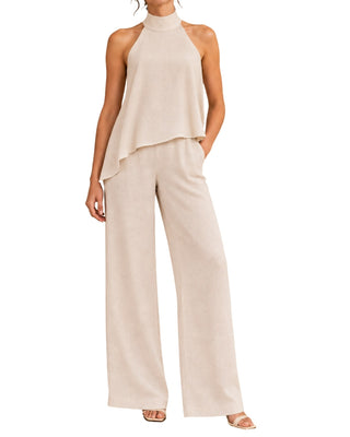 Ivana Asymmetrical Halter Top in champagne, closer front view of the sloped hemline over wide-leg pants
