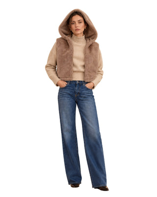 The Lara Faux Fur Hooded Vest - Sand – front view on model with the hood up