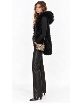 Sky Fur Hooded Vest in black over the Seamless Bodysuit, full-length side view with hood and ankle boots