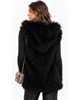 Sky Fur Hooded Vest in black, back view with hood down and long shaggy fur