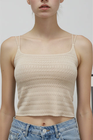 Elara Bralette Cami in cream, front view with textured knit and double thin straps, worn with jeans